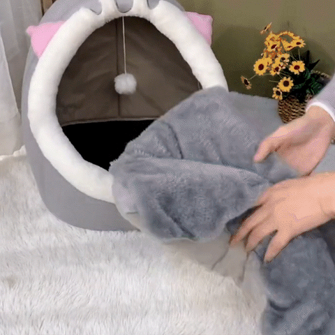 Gif animé d'un chat dans sa niche pour chat