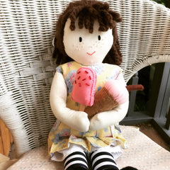 A Jemima doll eating ice-cream.