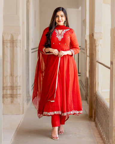 Chic red suit ensemble featuring delicate Kaccha-gota work in Kalidaar style