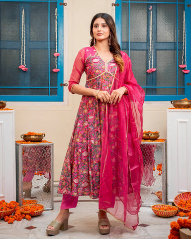 Elegant pink suit set adorned with charming floral motifs for a delightful look