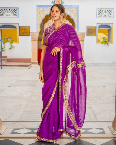 Elegant purple saree adorned with intricate Tamba work, perfect for special occasions