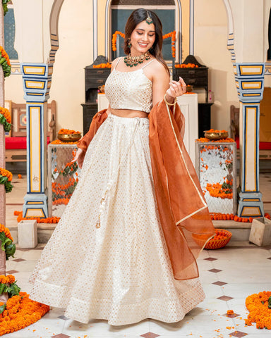 Fashionable self-embroidered lehenga set in a lovely ivory shade, perfect for special occasions