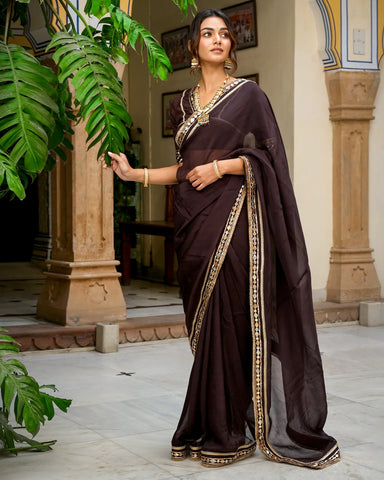 Graceful brown saree adorned with intricate Tamba work for a stylish and traditional look