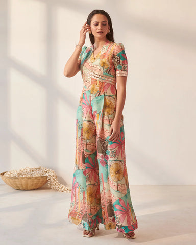 Graceful ivory jumpsuit adorned with intricate bright bloom details for a stylish appearance