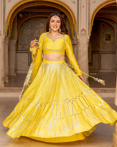 Modern lehenga set in yellow with traditional Gota work designs for a trendy appearance