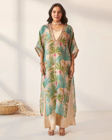Modern off-white kaftan set with intricate foliage detailing, offering a fresh and contemporary style