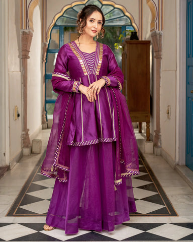 Modern sharara set in purple with traditional Tamba work designs for a trendy appearance