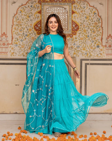 Modern turquoise lehenga set with traditional Gota work designs