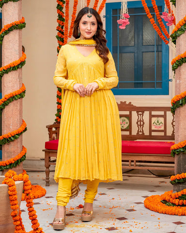 Mustard suit set with intricate Mukaish work for an elegant look