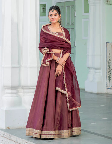 Royal wine lehenga set in tissue fabric with gota lace adding a touch of femininity