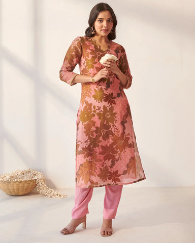 Stylish pink kurta set adorned with artistic abstract floral motifs
