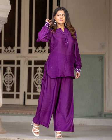 Stylish purple kurta set adorned with intricate embroidery