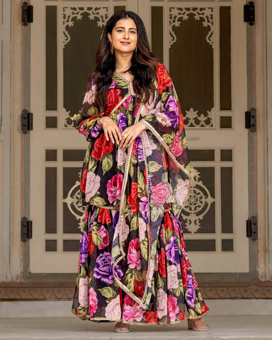 Trendy black sharara set showcasing charming floral motifs and Gota detailing