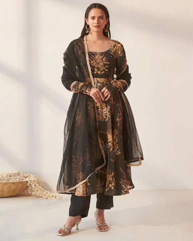 Trendy black suit set adorned with charming mythical floral prints, perfect for a fashionable statement