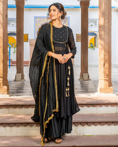 Trendy black suit set adorned with intricate Mukaish embroidery patterns, perfect for making a statement