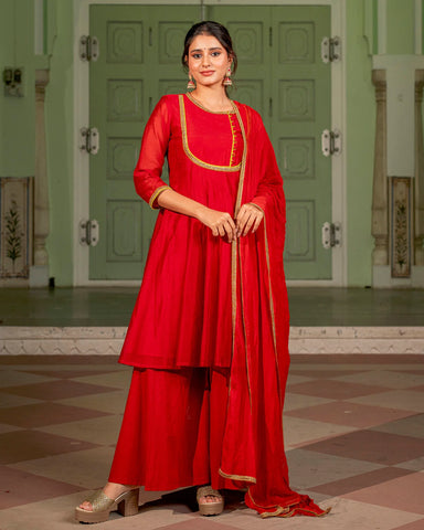 Trendy red Kalidaar Chanderi suit set for a fashionable and eye-catching statement