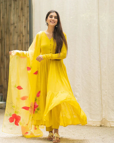 Trendy yellow suit set with an eye-catching handpainted cape for a contemporary statement