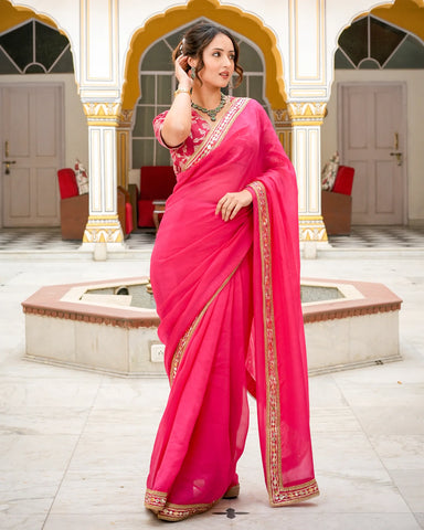 Vibrant hot pink saree adorned with intricate Tamba work for a traditional touch