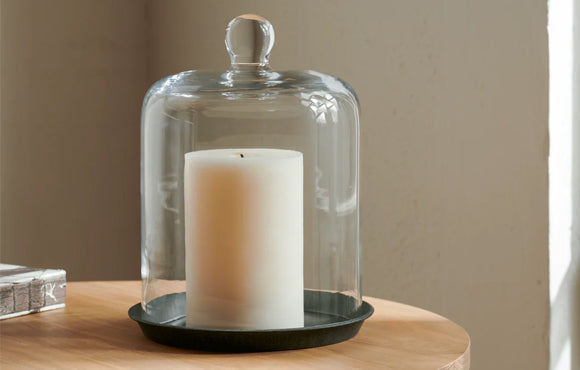 Cloche over a candle on tabletop