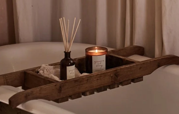 Geranium and orange scented candle in bathroon