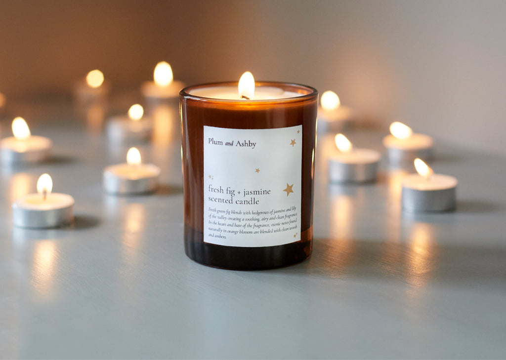 Tommy's and Plum and Ashby Charity Collaboration Candle surrounded by tea lights