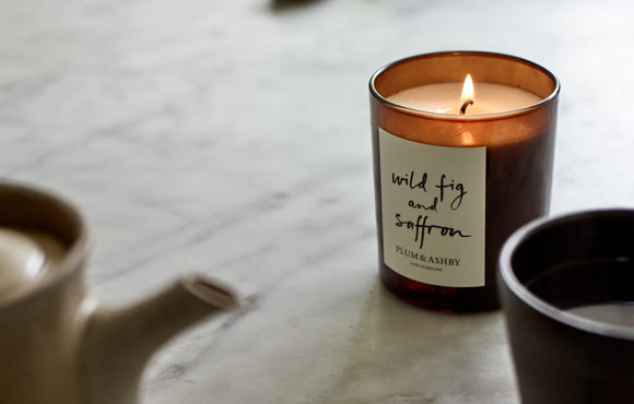 Wild fig and saffron scented candle on tabletop