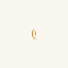 Mini Hoop: A close-up of a lightweight gold ring with a hinge clasp, designed for everyday wear. Sold individually.