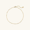 Gold Spheres Bracelet with a clasp, featuring a minimalist design, suitable for any occasion.