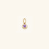 Close-up of the Birthstone Sphere Charm, showcasing a purple gem set in 14k solid gold, epitomizing love and fidelity.