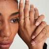 Close-up of a woman's hand showcasing a Bold Chain Ring, inspired by chain necklaces, handcrafted in hollowed 14k solid gold.