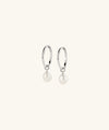 Organic Pearl Hoop Charms: A pair of elegant earrings featuring two hoop charms adorned with organic pearls, perfect for stylish occasions and versatile wear.