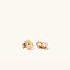 Bold Pearl Huggies: Handcrafted gold vermeil earrings with freshwater pearls, designed for stacking or solo wear.