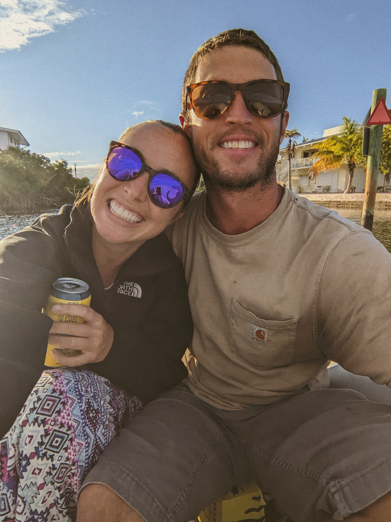 a couple sailing around the world while wearing sunski sunglasses