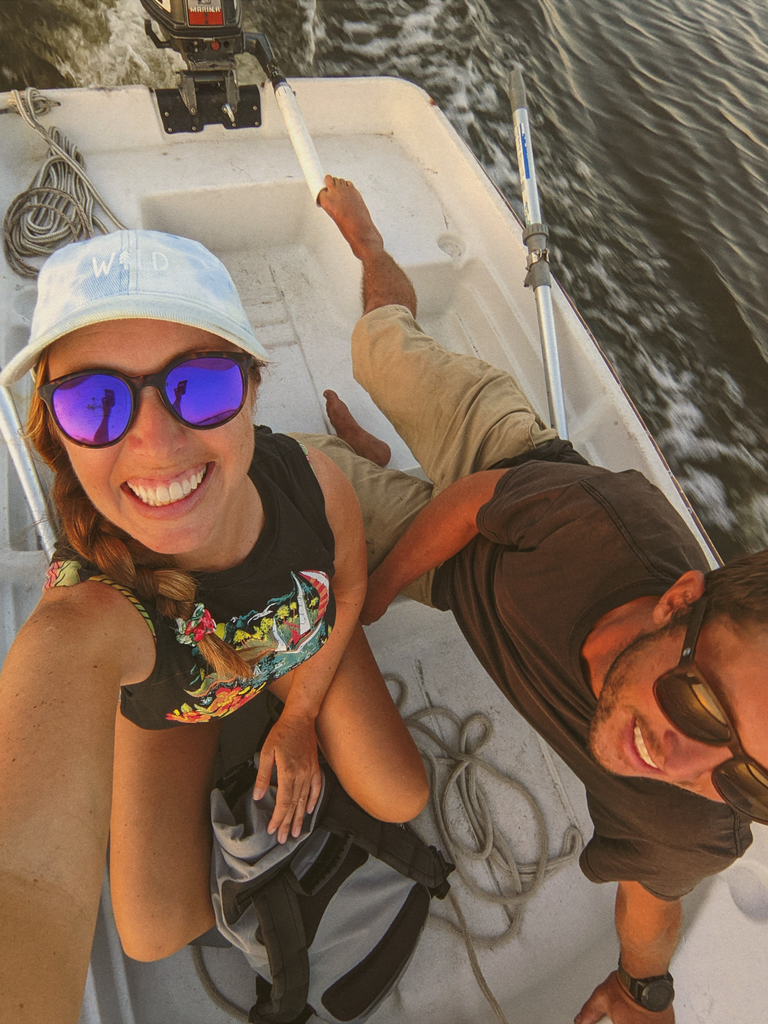 man and woman on a boat wearing sunski polarized sunglasses