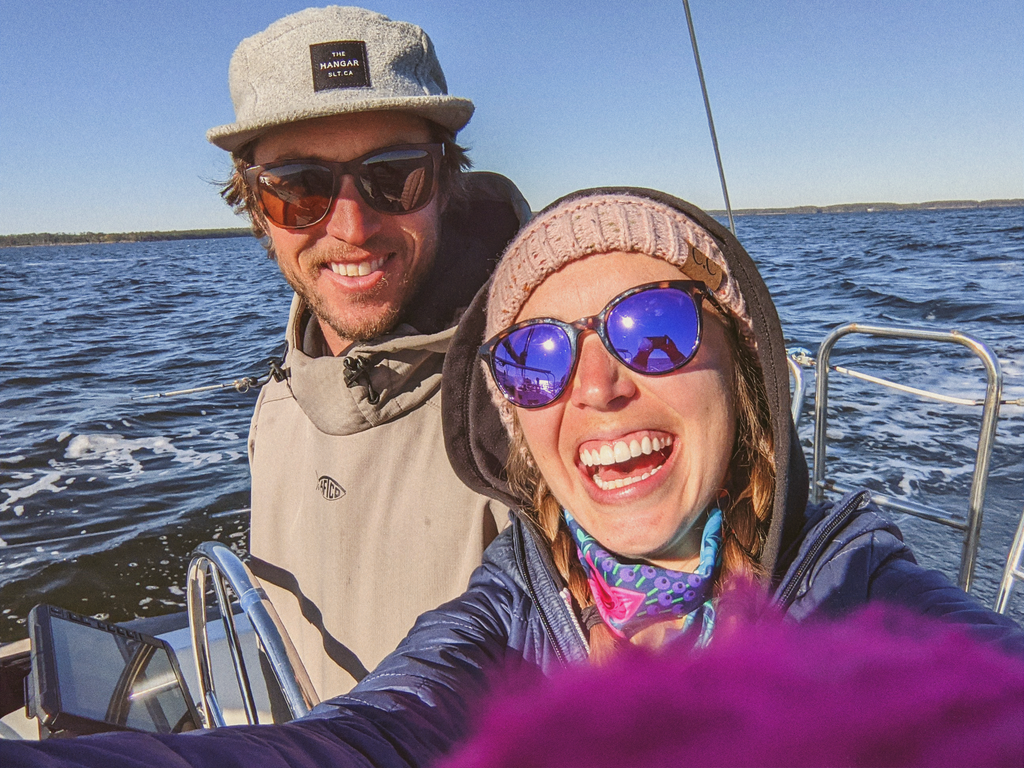 couple on a boat wearing sunski sunglasses