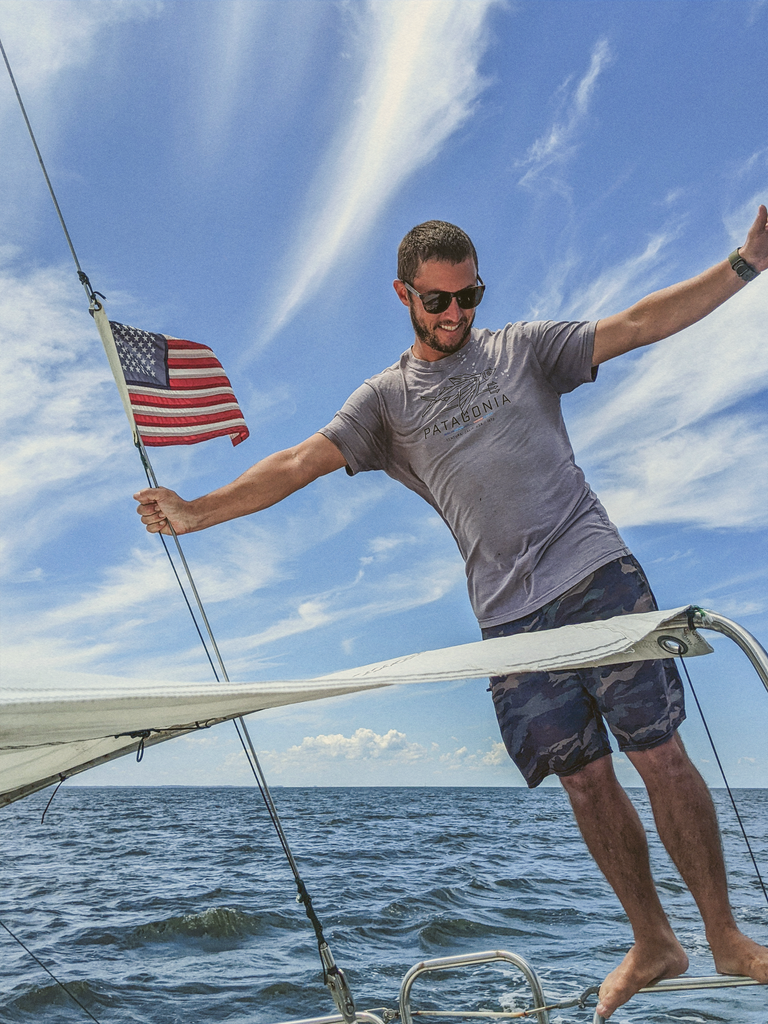 man on boat wearing sunski polarized sunglasses