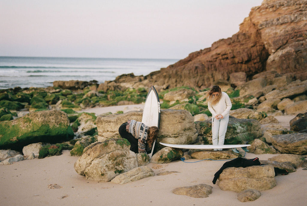 Prepping to surf the early morning waves