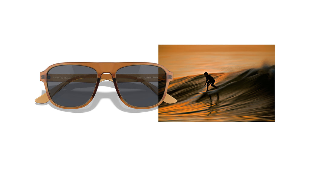 Orange sunset over ocean waves as color inspiration for sunglasses