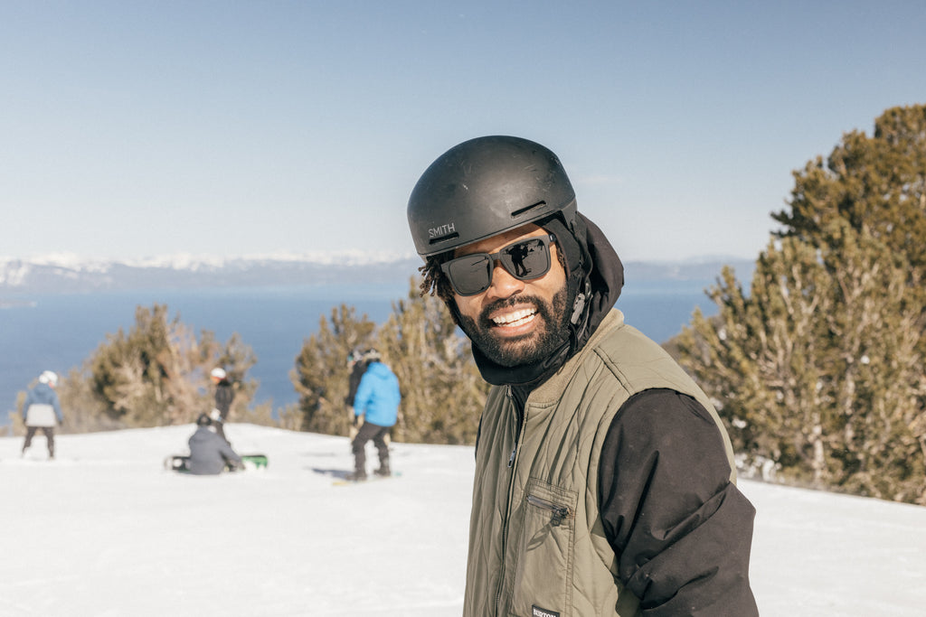 Man hitting the slopes clad in dark alpine sunglasses