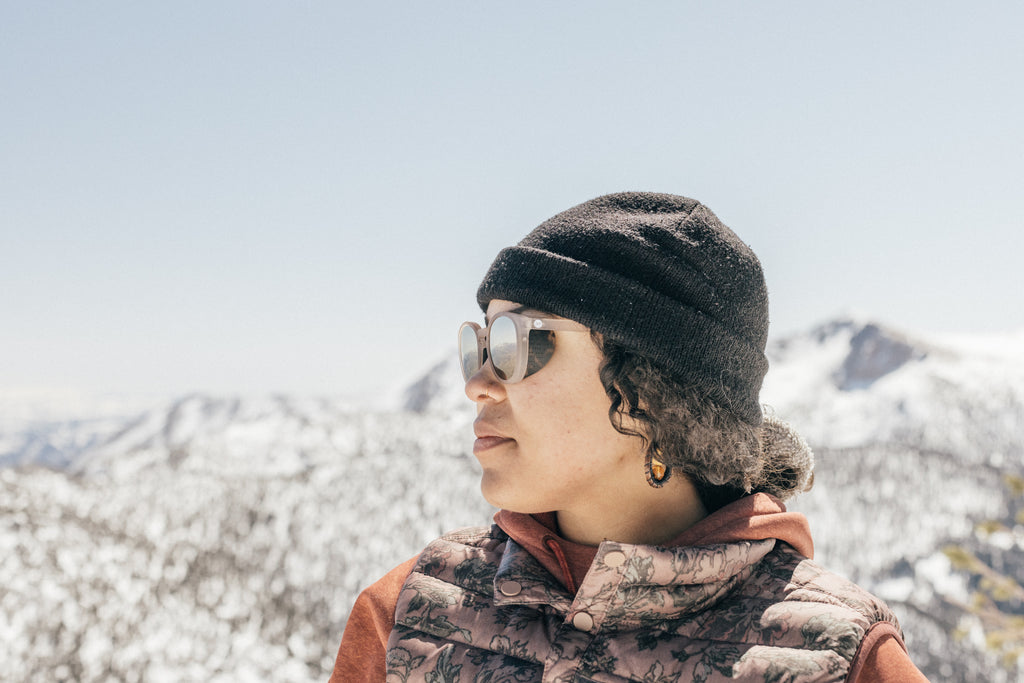 Soaking up the snowy mountain view in side shield sunglasses