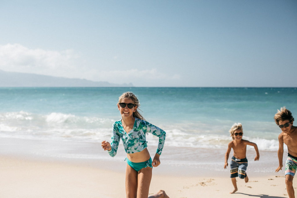 best kids sunglasses running on the beach