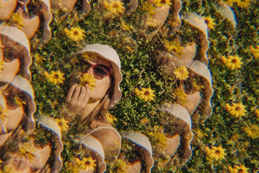 kaleidescope image of girl with a sunflower