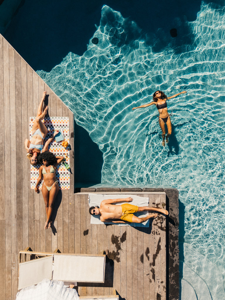 people lounging by the pool