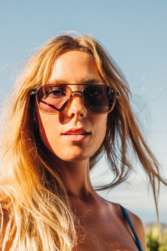 close up of girl wearing sunski estero sunglasses