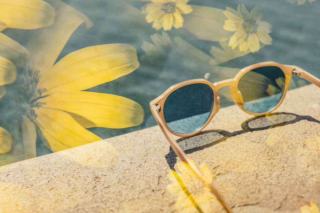 sunski vallarat sunglasses on a pools edge