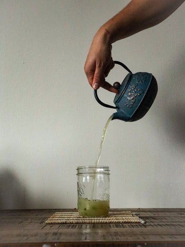 Image of sipping bone broth being poured from a japanese teapot