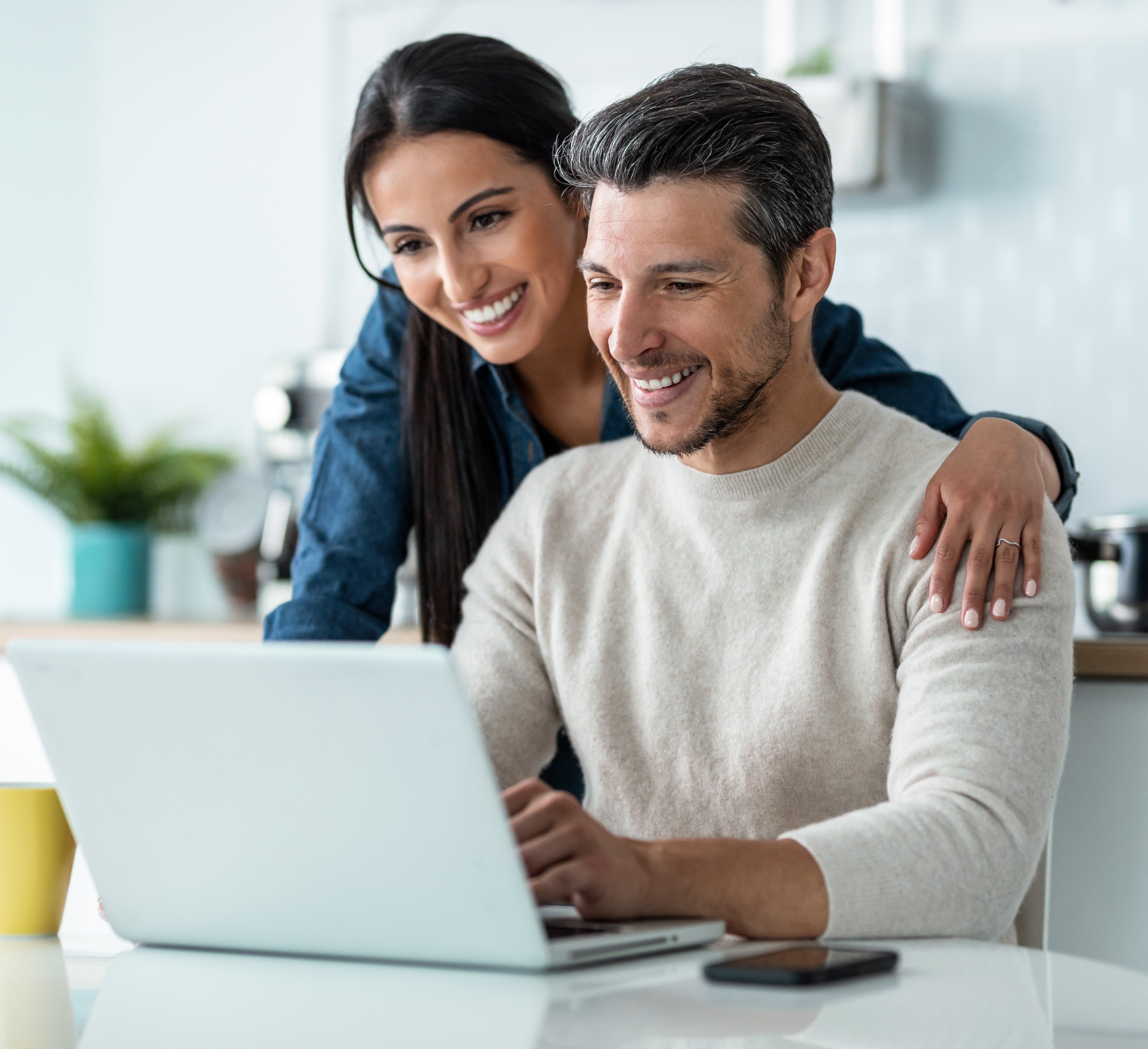 Couple looking at laptop