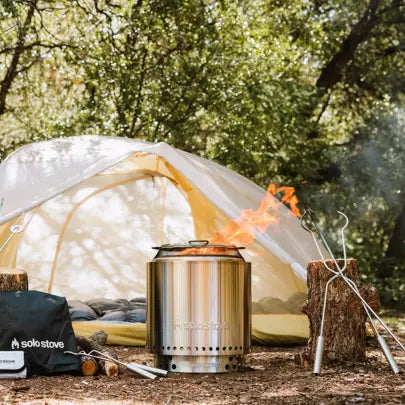 Solo Stove Ranger 2.0 on next to a tent for camping