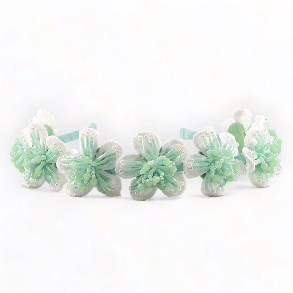 The Carys Girls Flower Headband has white lace flowers and is hand stitched with soft pastel mint crystals, perfect kids accessory for Easter and Special Occasions