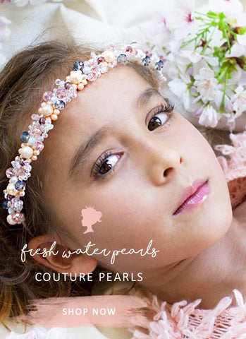 pretty flower girl wearing luxury pearl headpiece